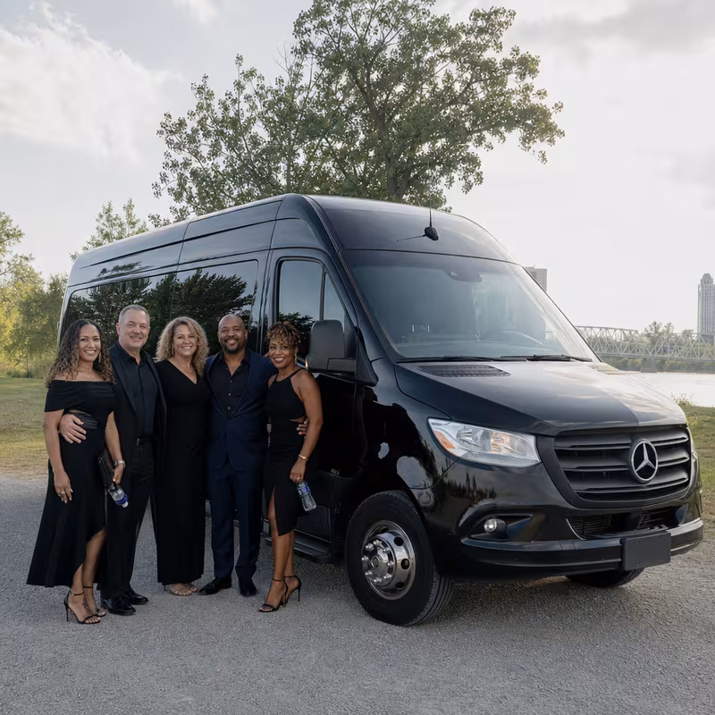 Group beside a Mercedes Sprinter limo from the Fort Wayne fleet