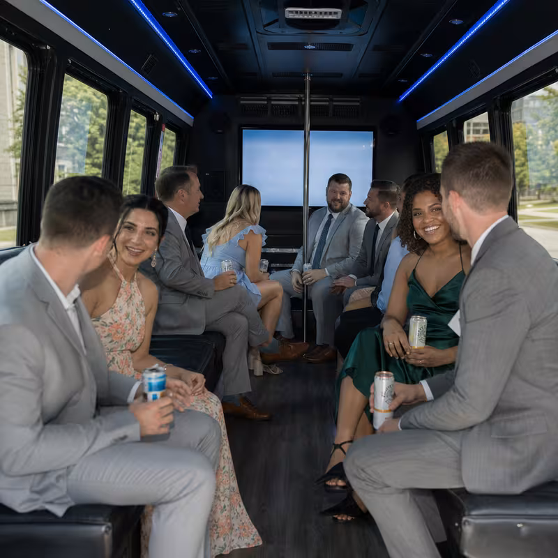 Wedding guests seated inside a Fort Wayne party bus
