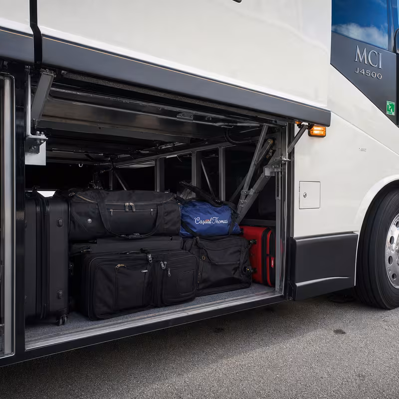 Party bus interior with wraparound leather seating and LED lighting in Fort Wayne