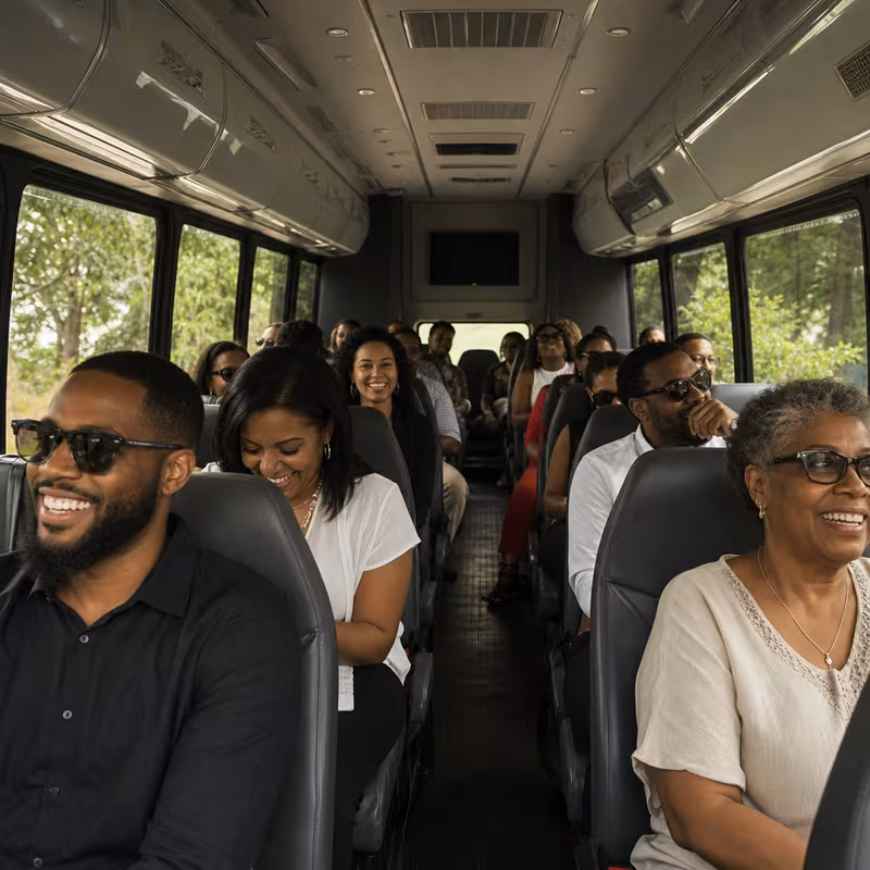 Group boarding a white charter bus for Private Event Transportation transportation in Fort Wayne