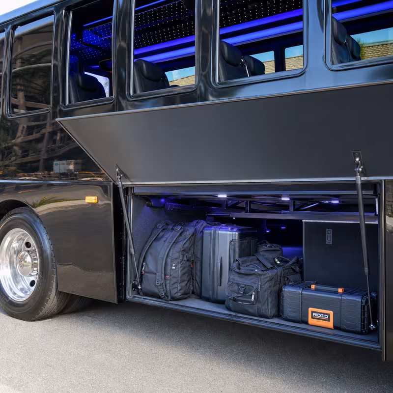 Party bus interior with wraparound leather seating and LED lighting in Fort Wayne