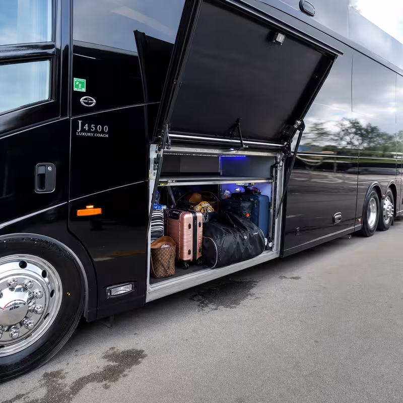 Party bus interior with wraparound leather seating and LED lighting in Fort Wayne